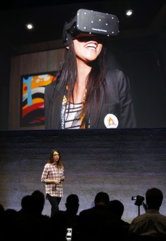 Anna Sweet, head of developer strategy at Oculus, helps introduces the Rift virtual reality headset during a media event at Oculus in San Francisco, Calif., on Thursday, June 11, 2015. (Karl Mondon/Bay Area News Group/TNS)