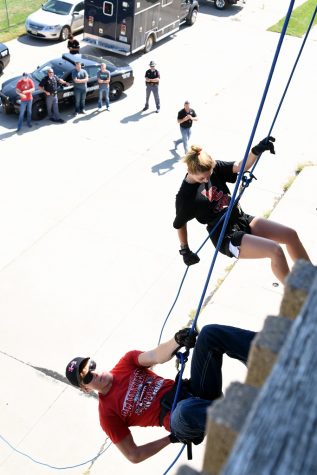 Schuyler Sauser, Plainview, and Madalynn Haschke, Spalding, freshmen criminal justice students at Northeast Community College, rappel down the side of the Norfolk Fire Division’s Training facility during a training exercise recently. Members of the Nebraska State Patrol’s Troop B SWAT Team assisted in the exercise which featured approximately 25 students (Courtesy Northeast Community College).