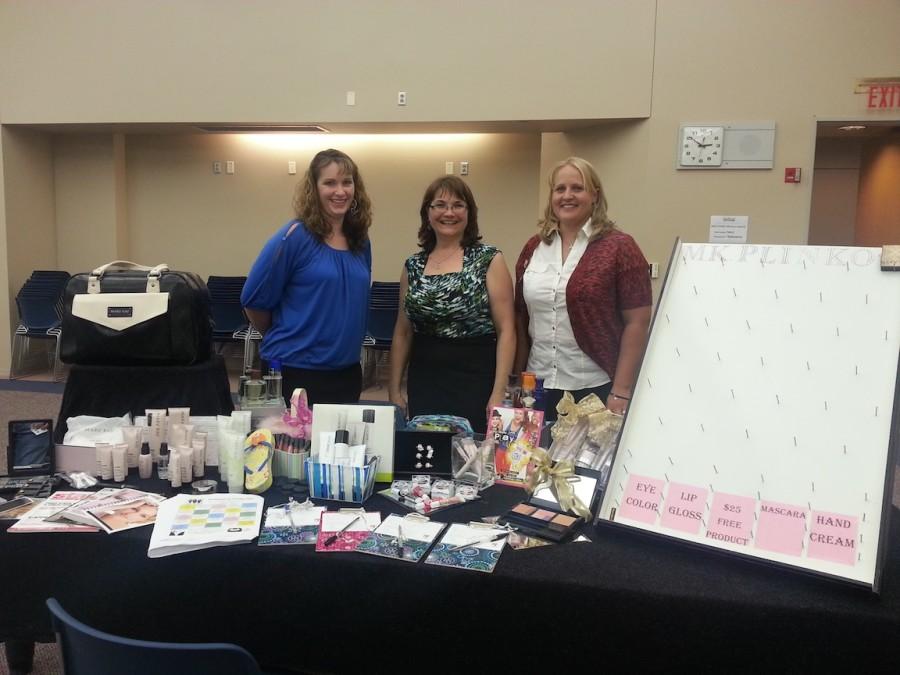 Mary Kay ladies and their booth.