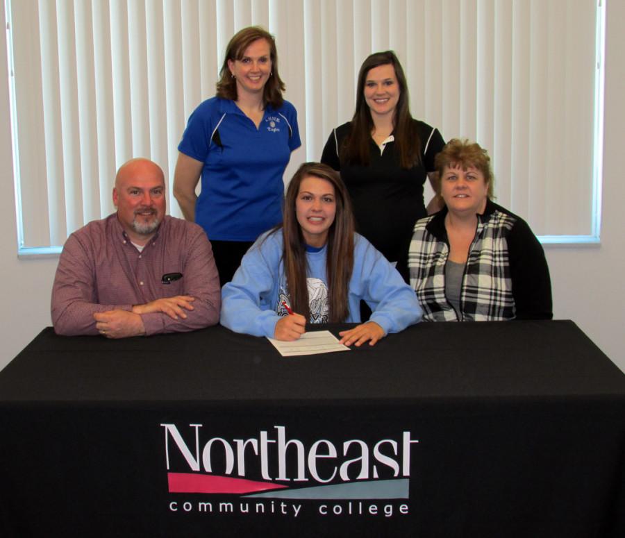 Morgan Uhlir, of Lutheran High Northeast in Norfolk, is joined by her parents and coaches as she signs to play volleyball this fall at Northeast Community College. Pictured (front row, from left) are Troy Uhlir, Morgan Uhlir, and Suzanne Uhlir. Back row (from left) Kathy Gebhardt, coach Lutheran High Northeast, and Amanda Schultze, Northeast Community College coach. (Courtesy Photo)  