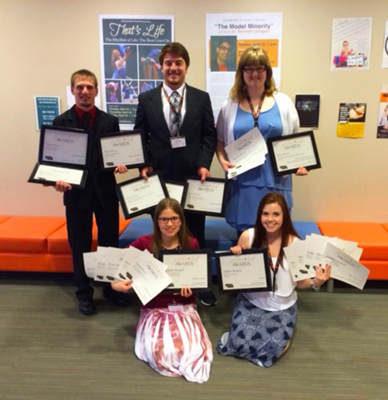 Northeast Community College broadcasting and mass media students hold the 28 awards they earned at the Nebraska Collegiate Media Association Golden Leaf Awards held recently at Doane College in Crete. Pictured in the first row (l-r) are Monika Zuch, Fremont and Marissa Lute, Laurel of The Viewpoint – Northeast’s online college newspaper. Back row (l-r) are Josh Spanjer, Aurora; Cody Ronnfeldt, Gibbon; and Kallie Hanson, Yankton, SD, of KHWK, Northeast’s campus radio station, and Hawk TV, the campus television station. (Courtesy Northeast Community College)
