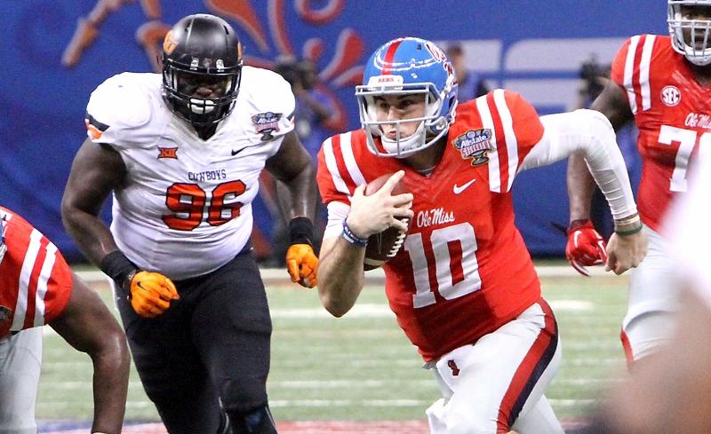 Ole Miss quarterback Chad Kelly (10) scrambles for a first down near the goal line to set up a Rebel touchdown before halftime against Oklahoma State in the Sugar Bowl at the Mercedes-Benz Superdome in New Orleans on Friday, Jan. 1, 2016. (Tim Isbell/Biloxi Sun Herald/TNS)