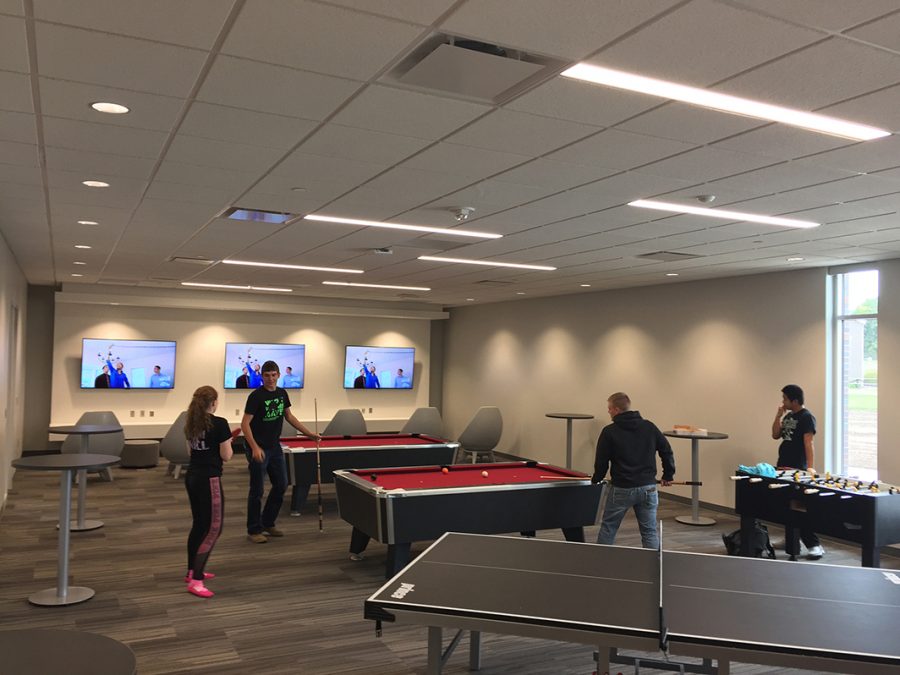 Students playing pool in the Hawks Point Game Room. Photo by Mark Lange
