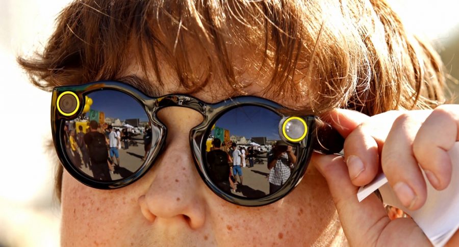Andy Milonakis, 16, tries on Snap Spectacles on Nov. 10, the day they went on sale. (Al Seib/Los Angeles Times/TNS)